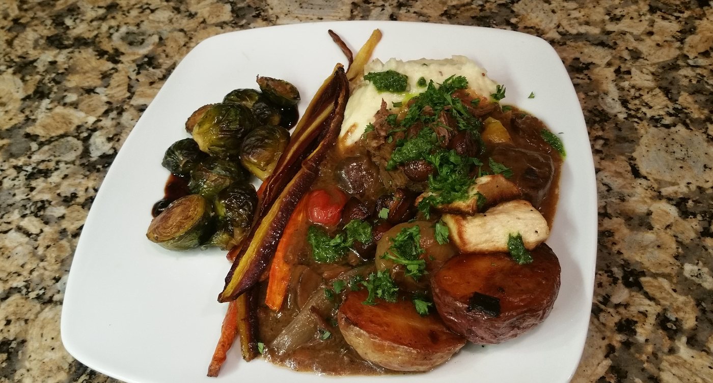 Braised vegan osso bocco plated elegantly
